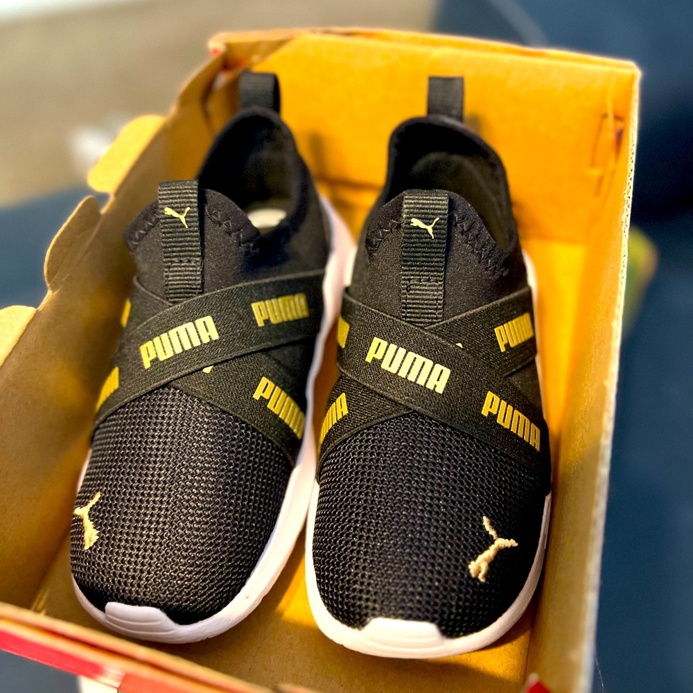 Black and gold kids Puma slide ons